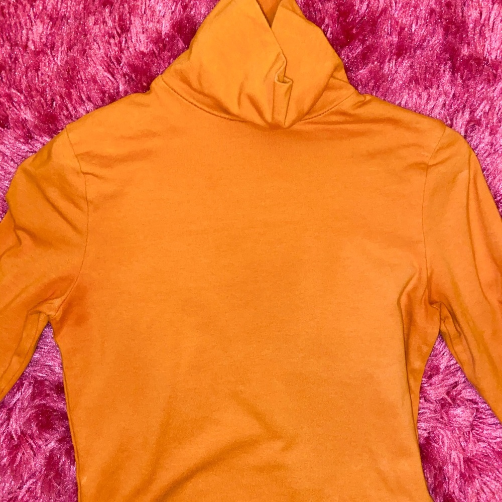 orange turtle neck